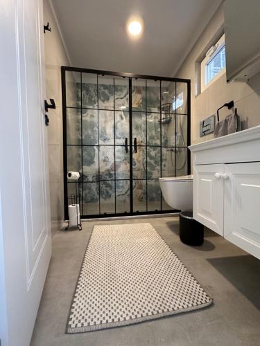 a bathroom with a shower with a glass door at Blue Eye 5 km from AirPort Dalaman in Dalaman