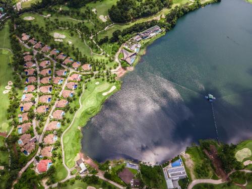 an aerial view of a park next to a lake at Coco Golf Villa in Ban Huai Luk (1)