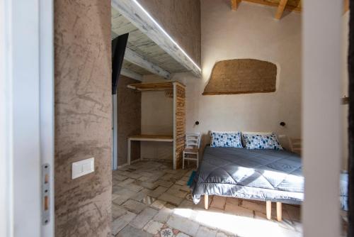 a bedroom with a bed in a room at Il tuo Relax in Càbras