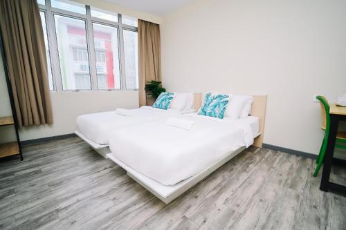 Cama o camas de una habitación en Swing & Pillows - Putrajaya Selangor