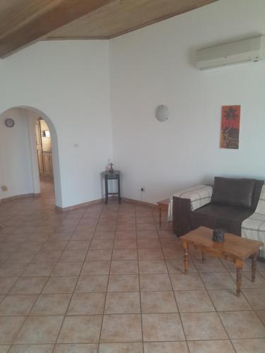 a living room with a couch and a coffee table at Bed on 22 in Ballito