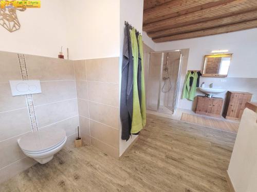 a bathroom with a toilet and a sink at Apartment Bühemirla by FiS - Fun in Styria in Altaussee