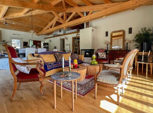 a living room with a couch and chairs at Villa Pol & Dod - Piscine et vue sublime in Monacia-dʼAullène