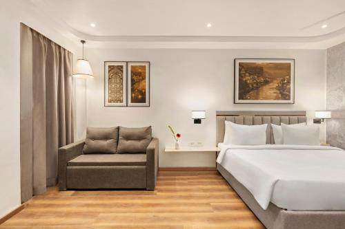 Voodi või voodid majutusasutuse Country Inn Ayodhya - opposite airport toas