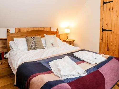 Postel nebo postele na pokoji v ubytování Horseshoe Cottage