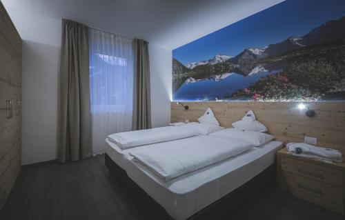 Postel nebo postele na pokoji v ubytování Apartments Schneider