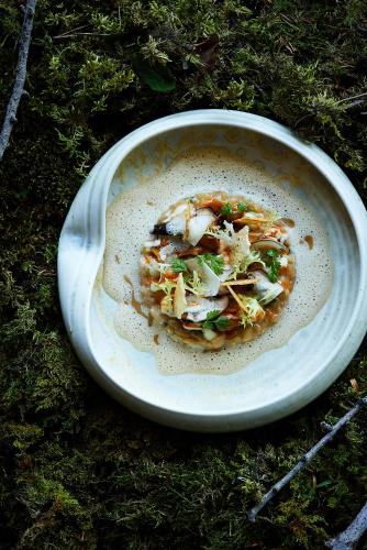 a plate of food sitting on the grass at Boutiquehotel Blaue Burg Falkenstein in Pfronten