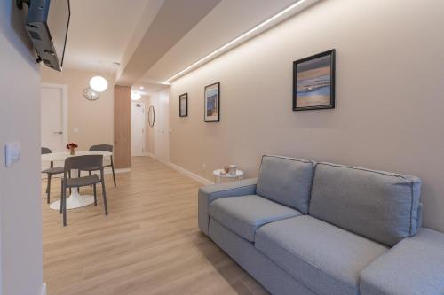 a living room with a couch and a table at HALO Vigo TRES in Vigo