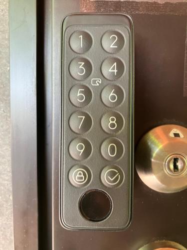 a close up of a remote control in an elevator at 季の家 - Ki no iE in Abashiri