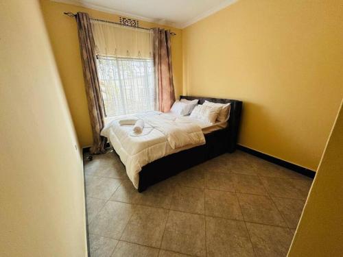 Postel nebo postele na pokoji v ubytování Mlay Home