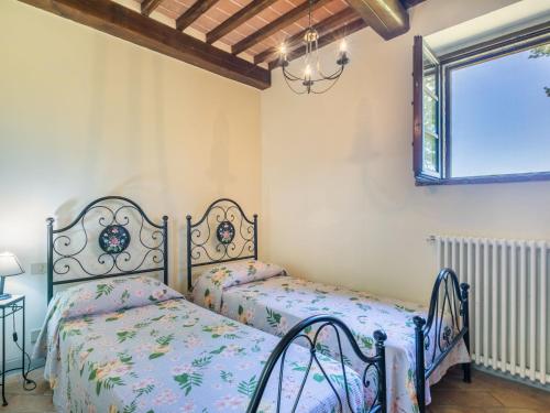 Ένα ή περισσότερα κρεβάτια σε δωμάτιο στο Holiday Home Podere S Giovanni by Interhome