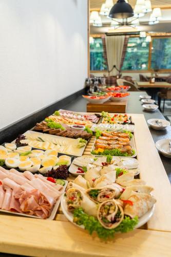 a buffet line with many different types of food at Hotel Maria & Spa in Szczawnica