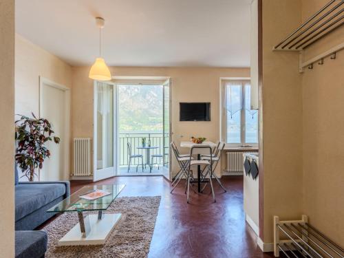 a living room with a couch and a table at Apartment Bosco by Interhome in Claino