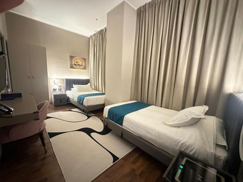 Postel nebo postele na pokoji v ubytování Hotel Royal