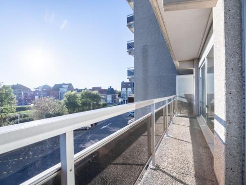a balcony of a building with a view of a street at Apartment Appartement 64-202 by Interhome in Bredene