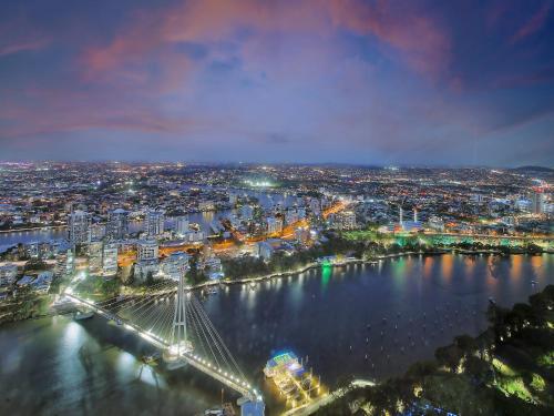 a view of a city with a bridge over a river at The Gatsby Escape Skytower Luxury Living at Level 71 in Brisbane