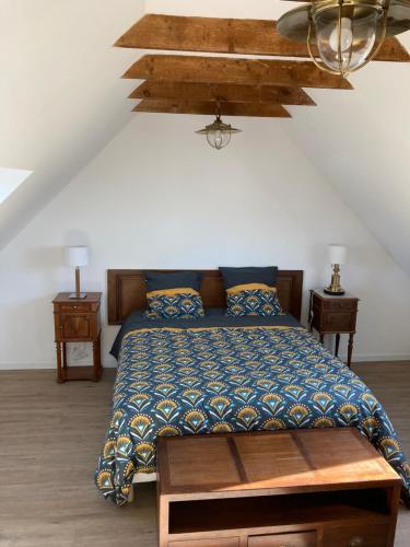 Postel nebo postele na pokoji v ubytování Le jardin des dunes