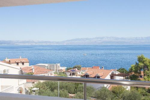 a view of the water from a balcony at Apartment Sanda in Stomorska