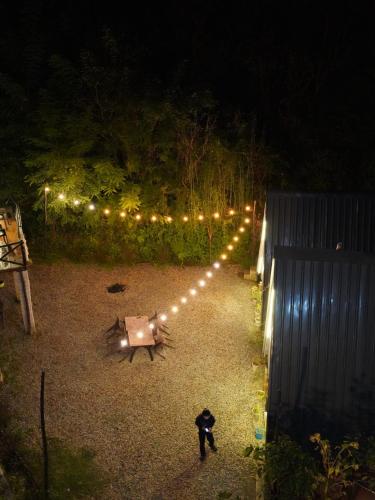 a view of a garden at night with lights at The Heavens Place in Nagar