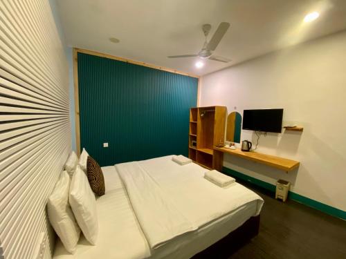 Postel nebo postele na pokoji v ubytování Elysian Hideaway