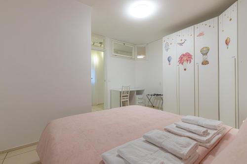 a bedroom with a bed with towels on it at Lugano Station Apartment with FREE PARKING in Lugano