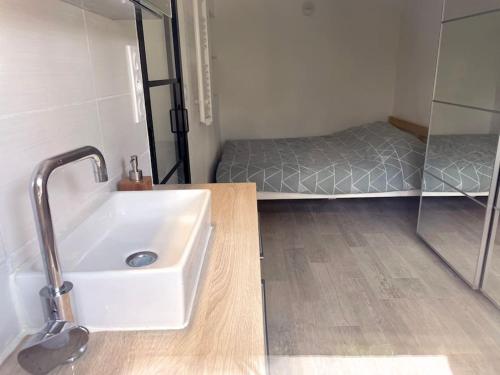 Ένα ή περισσότερα κρεβάτια σε δωμάτιο στο Joli appartement cosy - Castanet