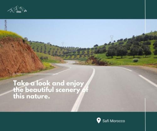 a picture of an empty road with the words take a look and enjoy the beautiful at Ait Mouli Agdal Retreat in Douar Debra