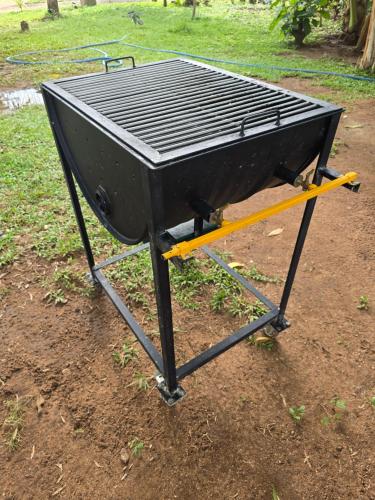 a black bbq grill sitting in the dirt at Ceylon Resort Wilpattu in Wilpattu