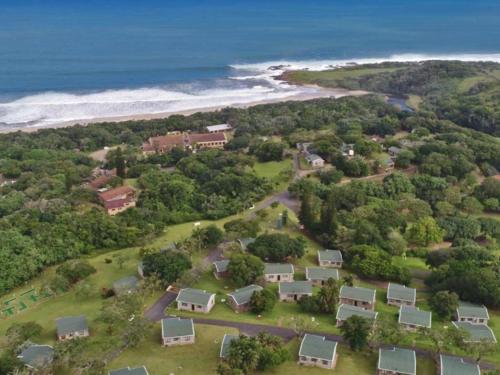 an aerial view of a house next to the beach at To Strand Holiday Resort in Port Edward