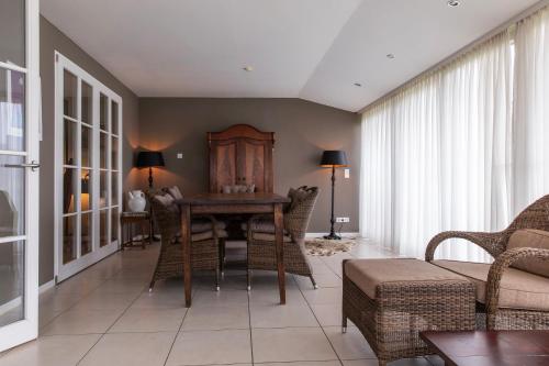 a living room with a wooden table and chairs at Ferienhaus Annabelle in Crivitz
