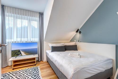 Giường trong phòng chung tại Ferienhaus "Ankersteed"