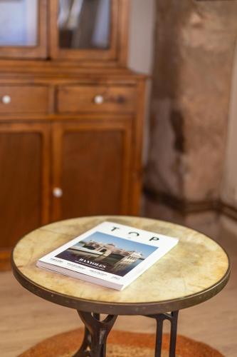 a table with a book on top of it at Charming barn in Mas Simon in Santenys