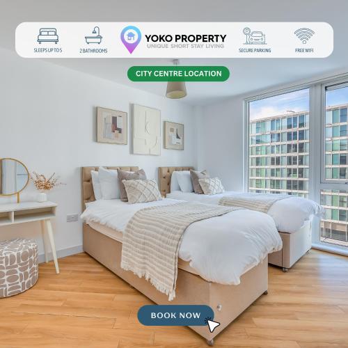 two beds in a white room with a window at Stunning City Centre Apartment with Balcony, Free Parking, Fast Wifi and SmartTVs by Yoko Property in Milton Keynes