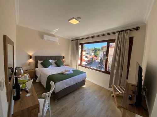 Postel nebo postele na pokoji v ubytování PRUVA İNN HoTEL