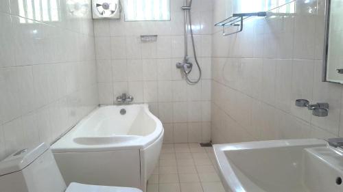 a bathroom with a toilet and a sink and a shower at Alkimia in Weligama