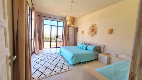Postel nebo postele na pokoji v ubytování Lalla Essaouira, Villa Khmissa avec piscine pour 13 personnes