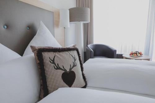 Postel nebo postele na pokoji v ubytování Kunzmann's Hotel | Spa