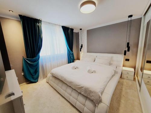 Ένα ή περισσότερα κρεβάτια σε δωμάτιο στο Opper luxury apartament