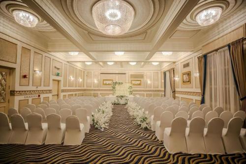 a banquet hall with rows of chairs in a room at Steigenberger Cecil Hotel Alexandria in Alexandria