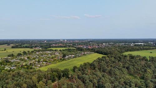 an overhead view of a town in the middle of a forest at Hofparken De Bergvennen in Lattrop