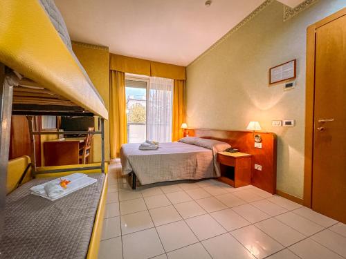 Postel nebo postele na pokoji v ubytování Hotel Remin Plaza