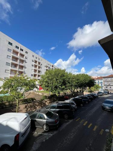 a row of cars parked in a parking lot at Casa Augusta 6 in Braga