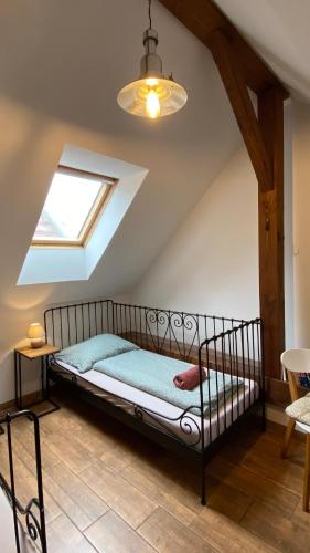 a bedroom with a bed in a attic at Penzion Panská in České Budějovice