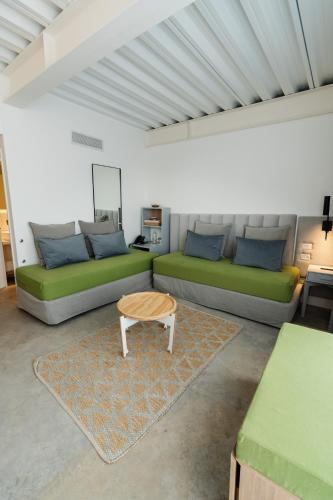 a living room with two couches and a coffee table at Vain Boutique Hotel in Buenos Aires