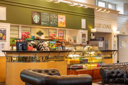 a fast food restaurant with a counter and chairs at Bromsgrove Hotel and Spa in Bromsgrove