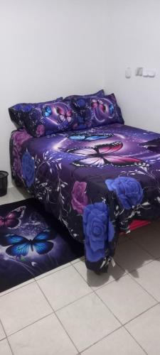 a couple of beds sitting next to each other at Holiday rooms in St Thomas Jamaica in Clifton