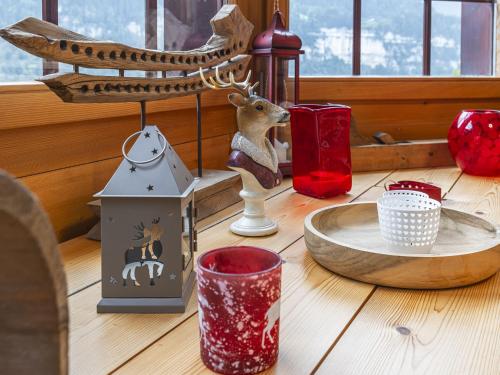 a table with christmas items on it at Apartment Bouquetins by Interhome in Champéry