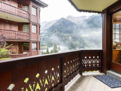 a balcony with a view of the mountains at Apartment Bouquetins by Interhome in Champéry