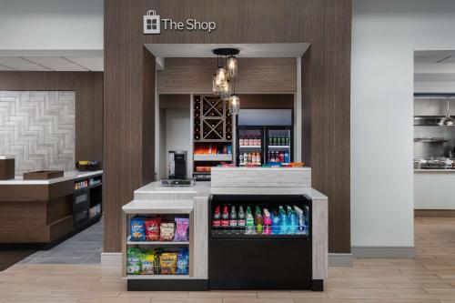 a drink station in a restaurant with a drink cooler at Hilton Garden Inn Wilkes-Barre in Wilkes-Barre
