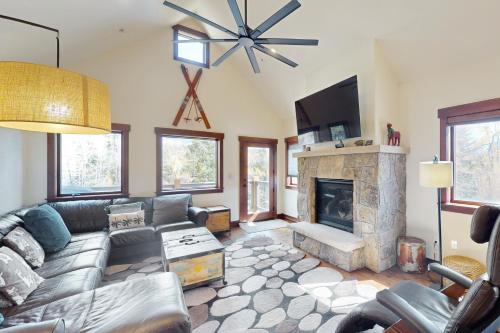 a living room with a couch and a fireplace at Blue River Condo Unit 203 in Silverthorne